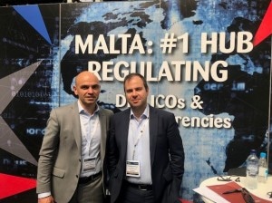 Simon Schembri and Leonard Bonello in front of Malta booth at Global Blockchain Expo in London